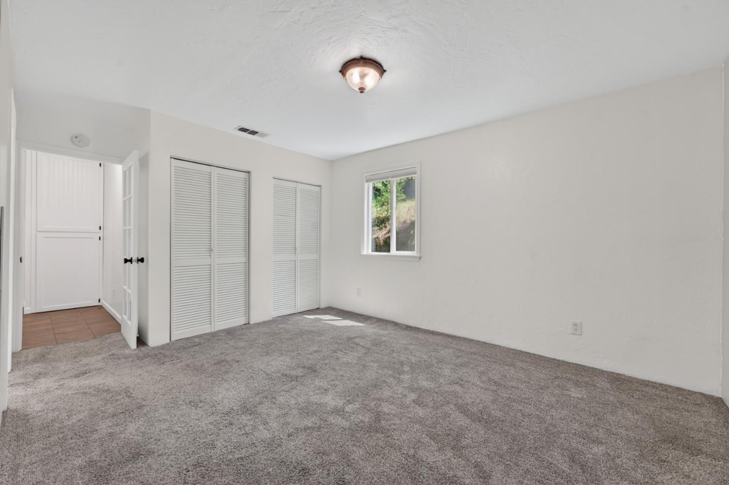 4340 Fairglade Road Placerville, CA 95667 - Photo 26 of 42 a view of an empty room with a window