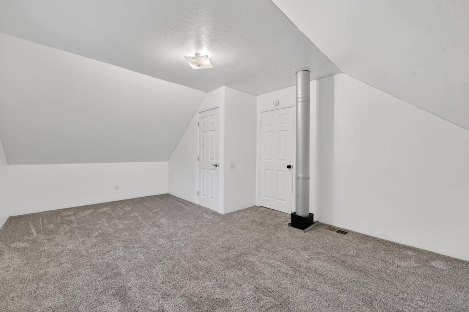 4340 Fairglade Road Placerville, CA 95667 - Photo 32 of 42 an empty room with chandelier fan