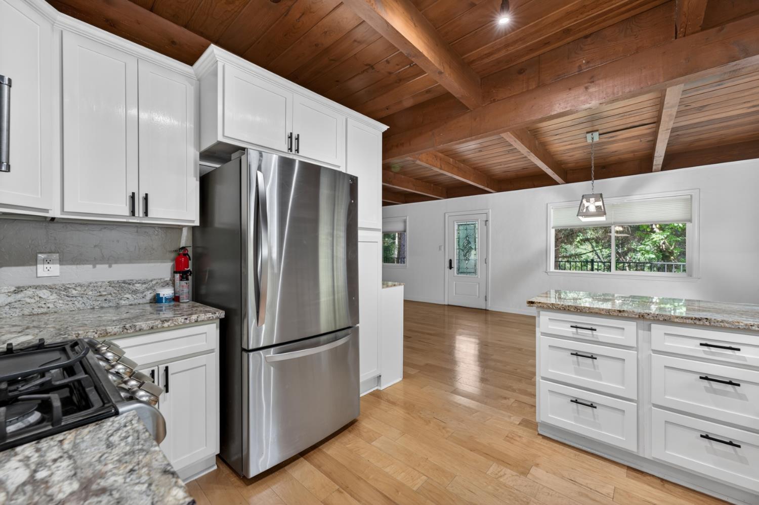 4340 Fairglade Road Placerville, CA 95667 - Photo 8 of 42 a kitchen with stainless steel appliances granite countertop a refrigerator and a stove