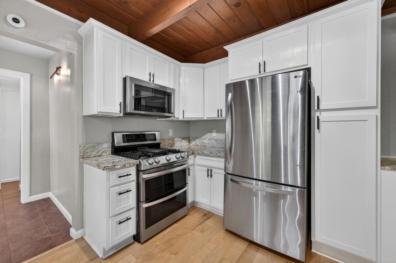 4340 Fairglade Road Placerville, CA 95667 - Photo 10 of 42 a kitchen with stainless steel appliances a refrigerator stove and microwave