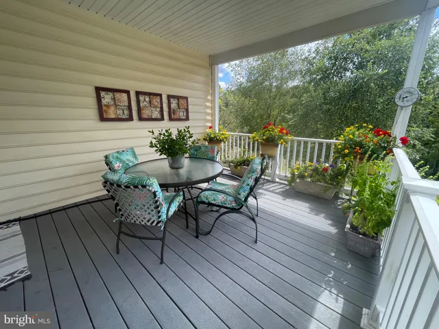 a view of a balcony with chairs