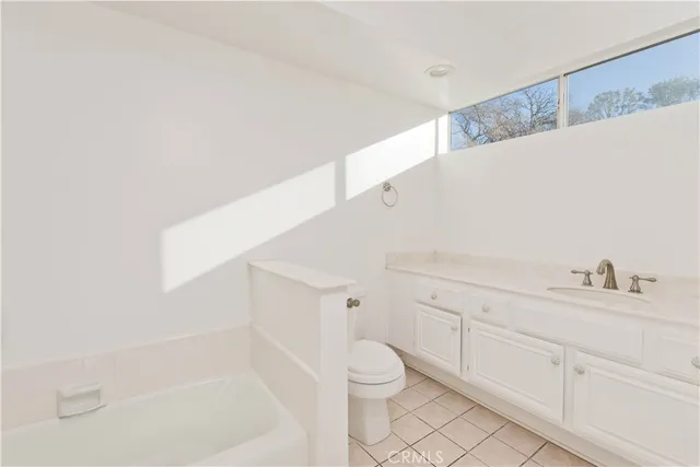 a bathroom with a toilet sink and a bathtub
