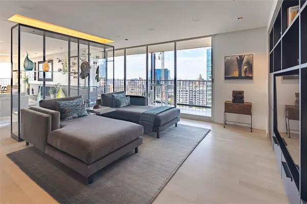 a spacious bedroom with a large bed and a large window