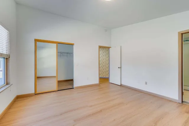 a view of an empty room and window