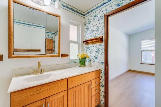 a bathroom with a sink and a mirror