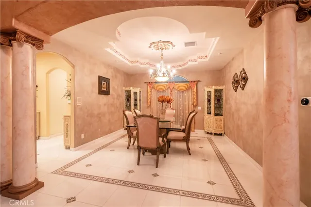 a large kitchen with lots of furniture a sink appliances and cabinets