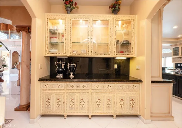 a large kitchen with stainless steel appliances granite countertop a sink and cabinets