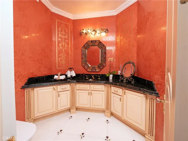 a kitchen with a sink cabinets and window