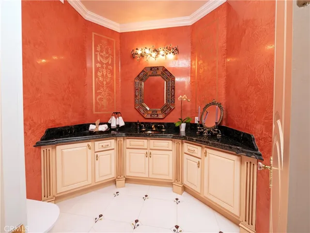 a kitchen with a sink cabinets and window