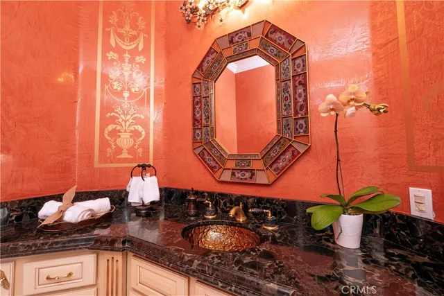 a kitchen with white cabinets and appliances