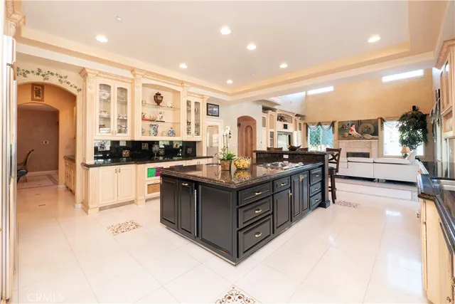 a dining room with furniture a rug and a large window