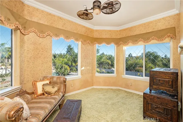 a bedroom with a bed and a potted plant