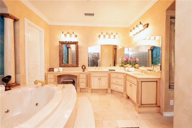 a spacious bedroom with a bed and a large window