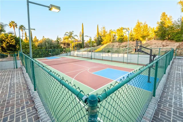a view of a dining room with furniture and a chandelier