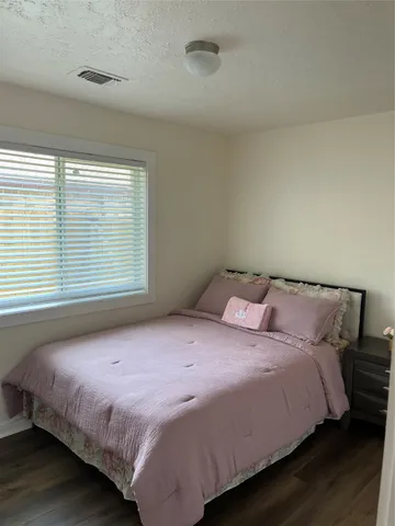 a white toilet sitting next to a shower