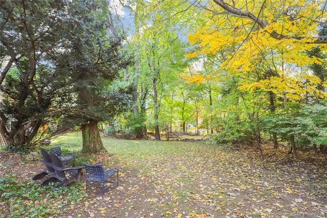 a picture of a bench in front of a wall