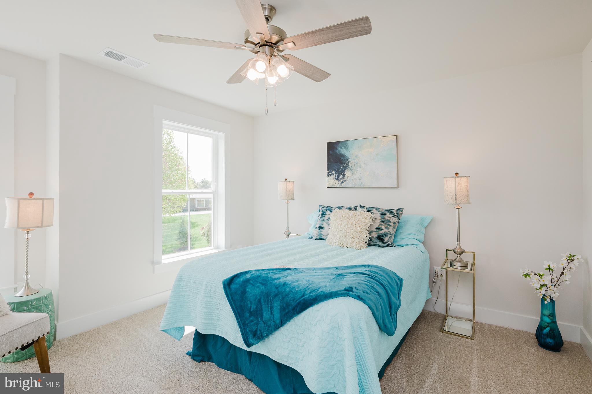 5725 Hodges Road Sykesville, MD 21784 - Photo 14 of 56 a bedroom with a large bed and a window