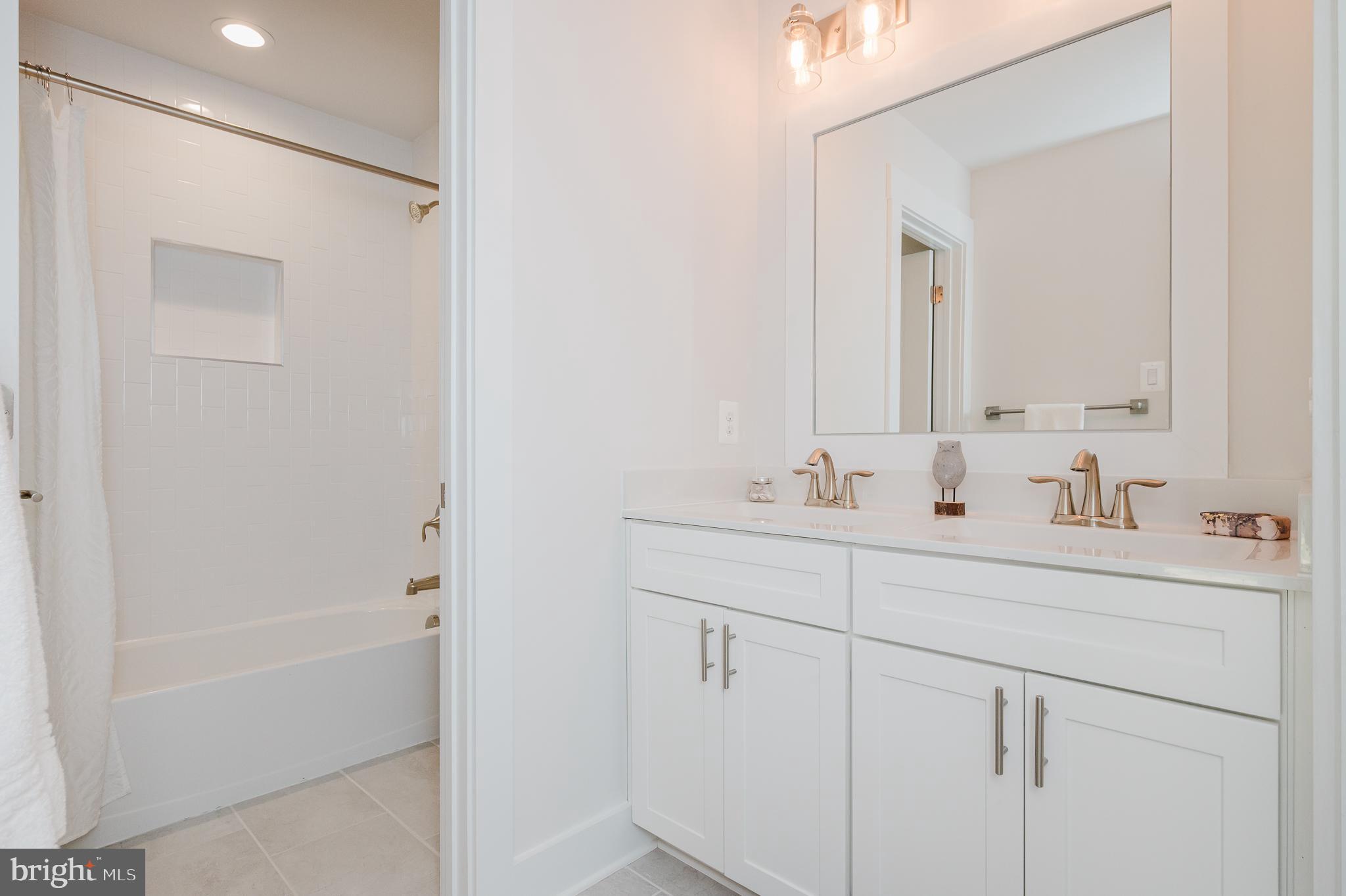 5725 Hodges Road Sykesville, MD 21784 - Photo 15 of 56 a bathroom with 2 sink tub and a mirror