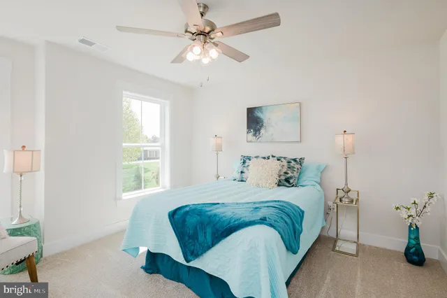 a bathroom with 2 sink tub and a mirror