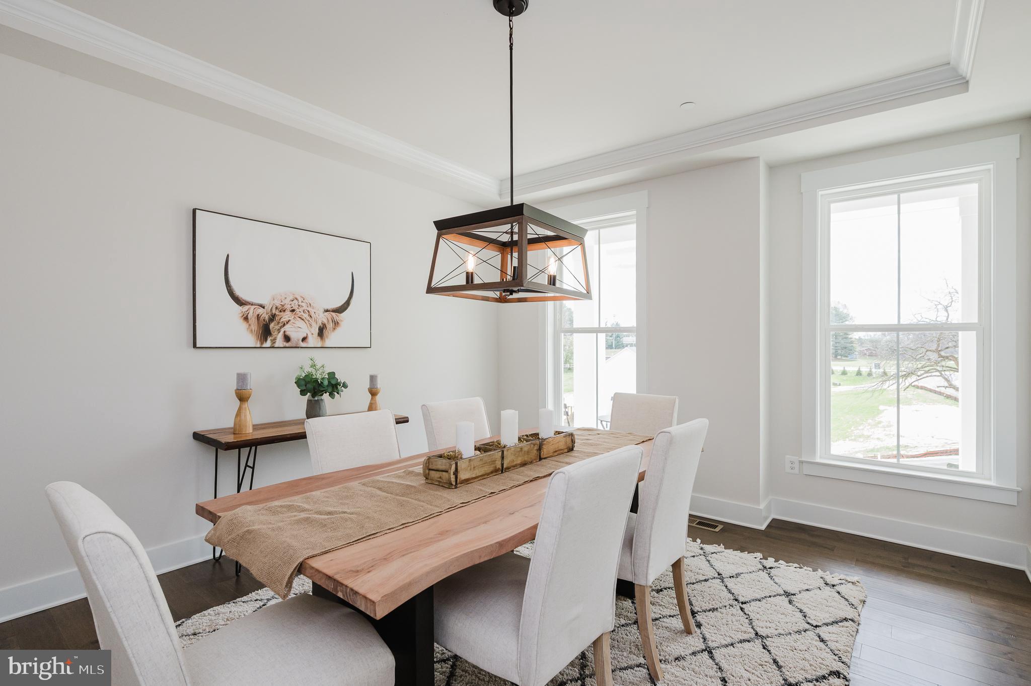 5725 Hodges Road Sykesville, MD 21784 - Photo 2 of 56 a dining room with furniture a rug and wooden floor