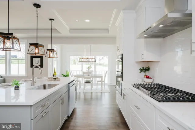 a kitchen with a table and chairs in it