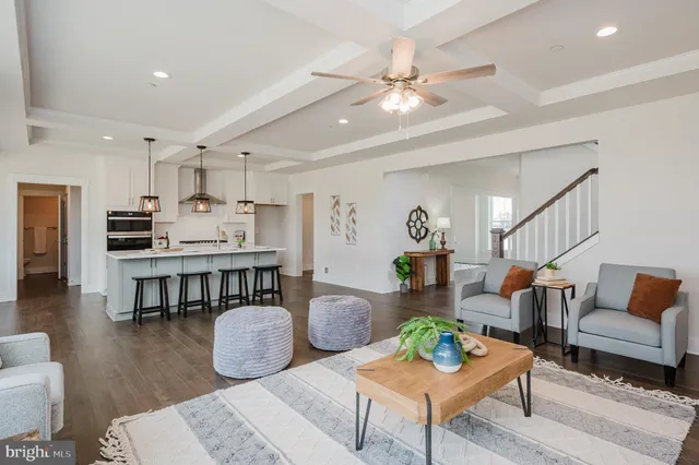 a spacious bedroom with a bed and a chandelier