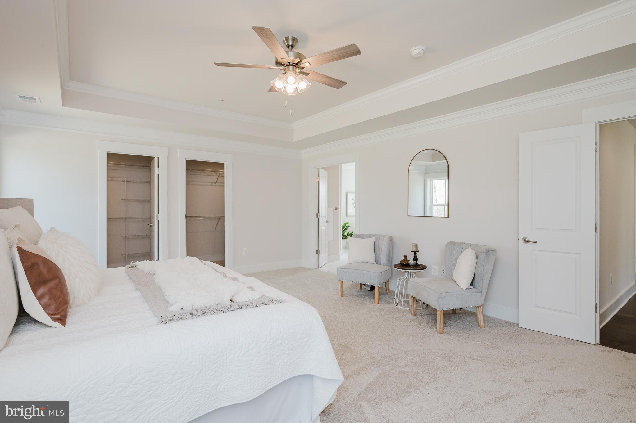 5725 Hodges Road Sykesville, MD 21784 - Photo 40 of 56 a spacious bedroom with a bed and a chandelier