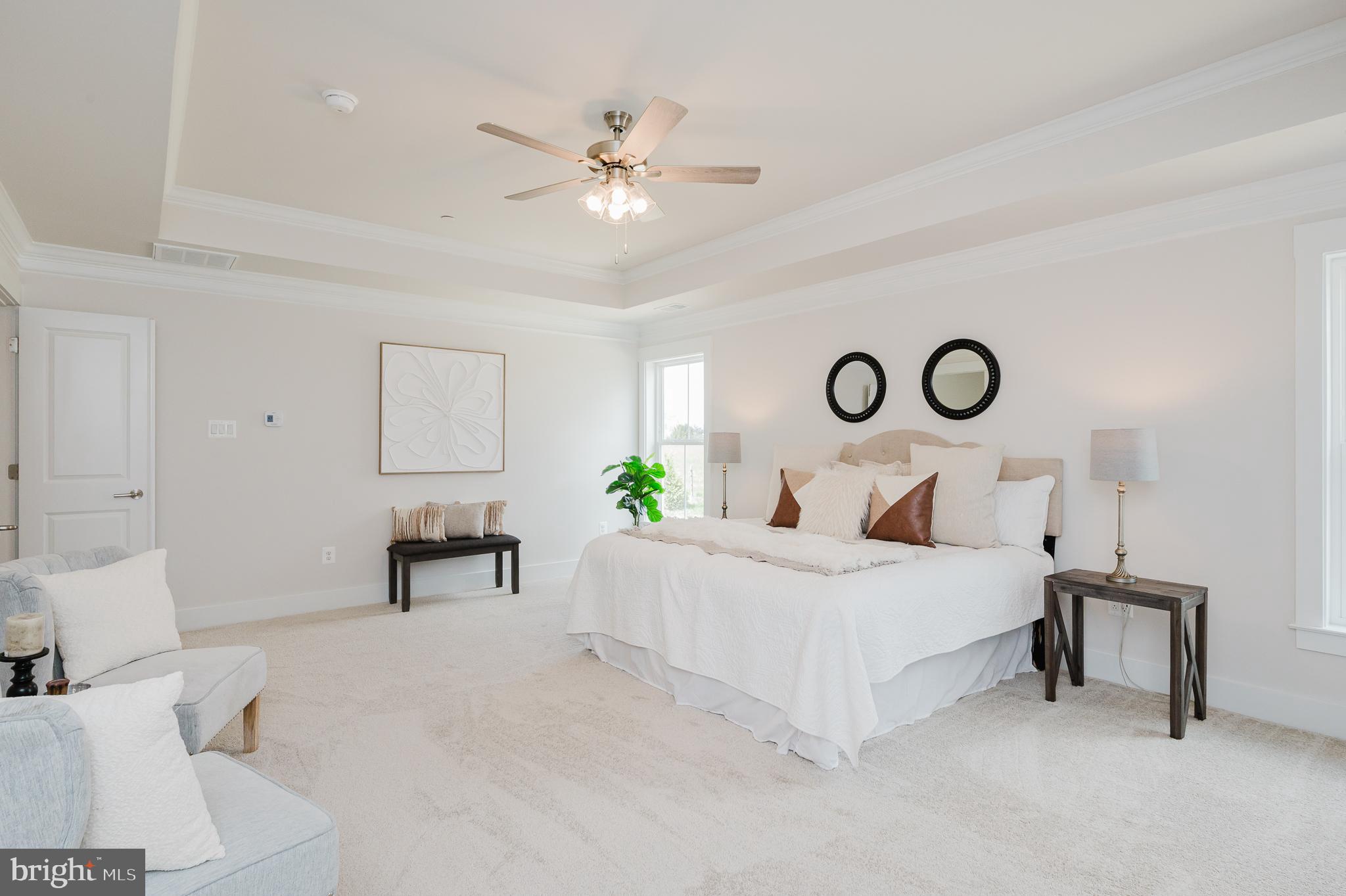 5725 Hodges Road Sykesville, MD 21784 - Photo 42 of 56 a bedroom with a bed and a chandelier