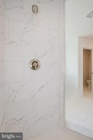 a bathroom with a toilet and a bathtub