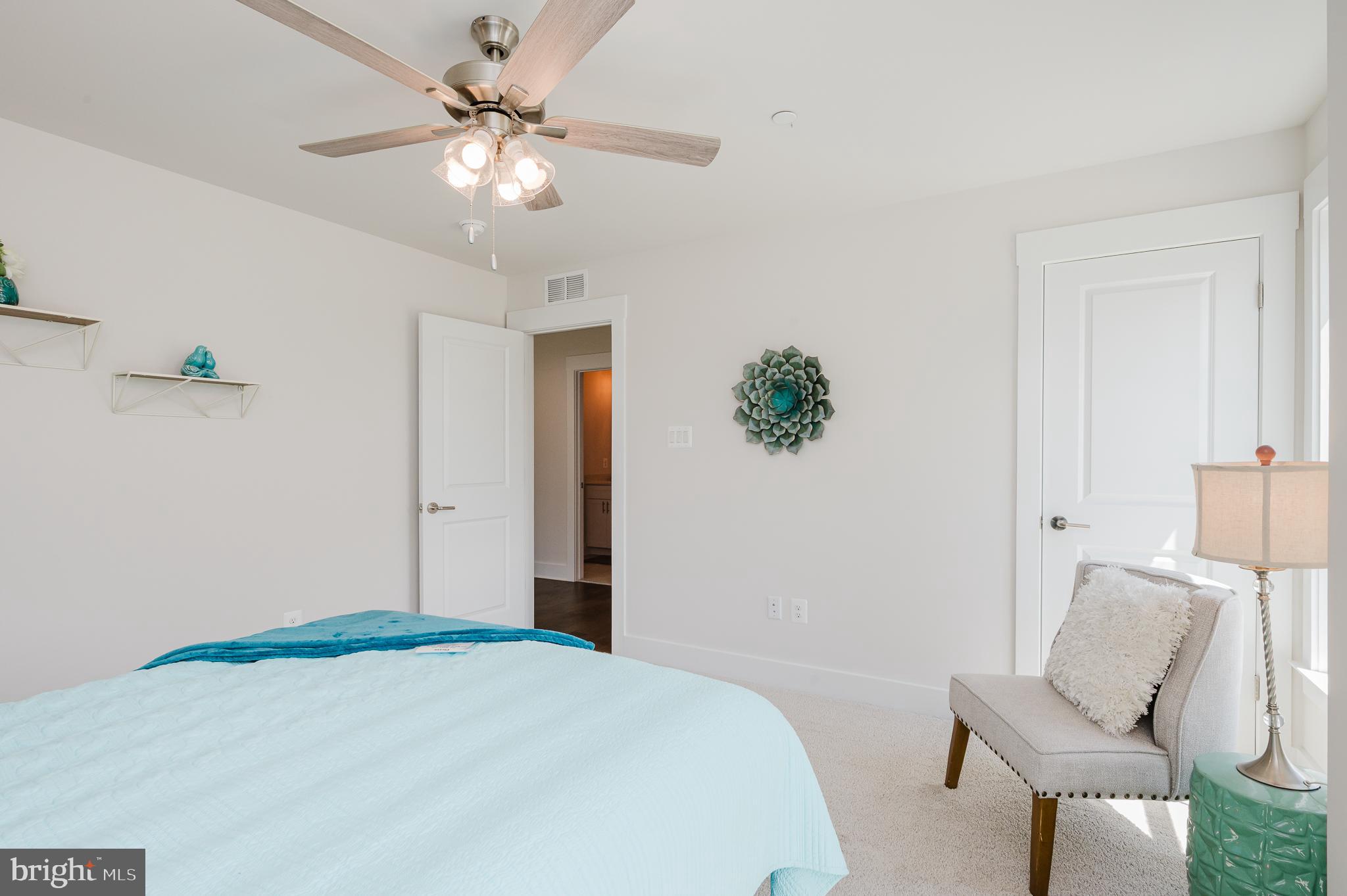 5725 Hodges Road Sykesville, MD 21784 - Photo 51 of 56 a bedroom with a bed and a chair