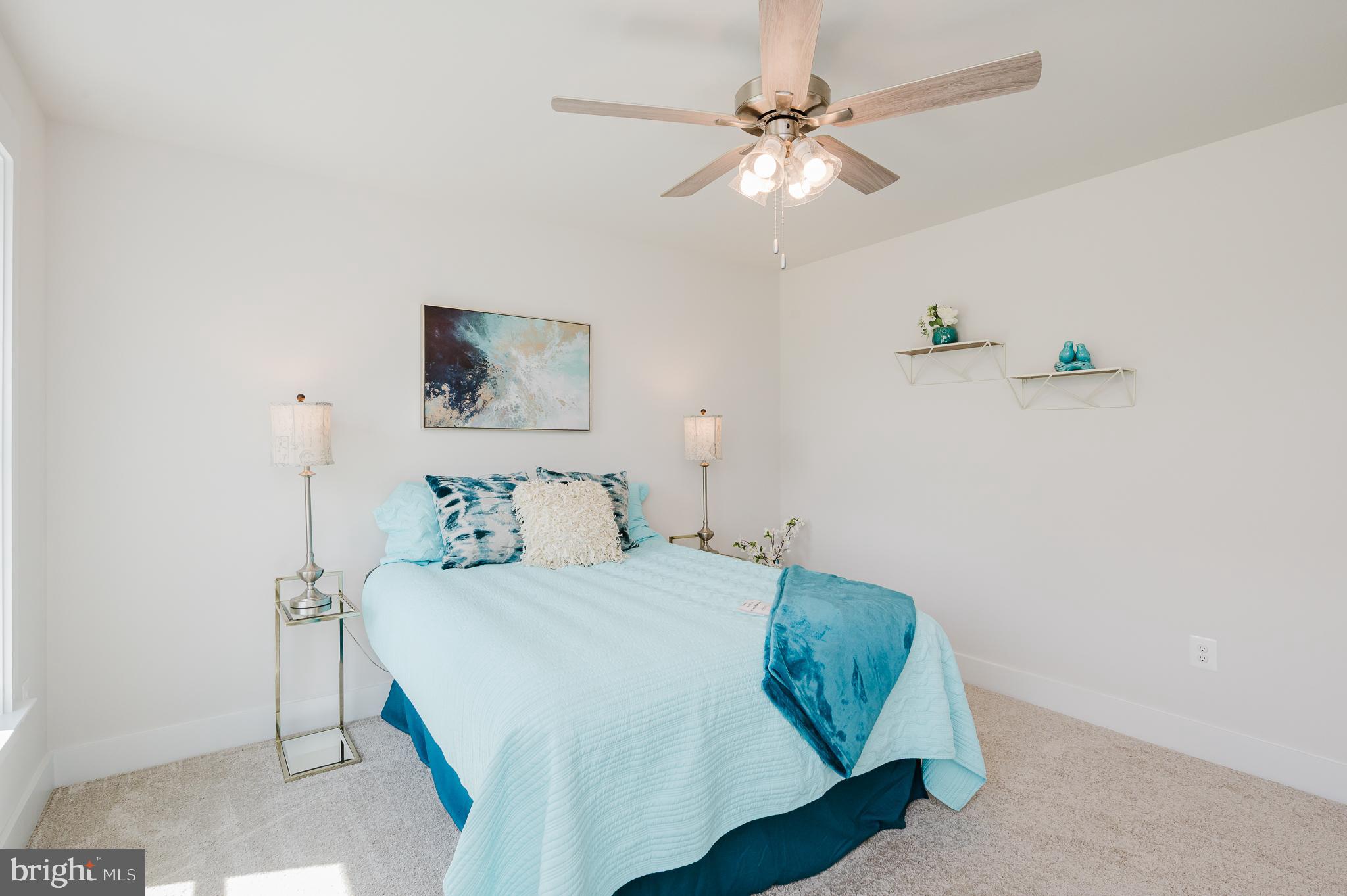 5725 Hodges Road Sykesville, MD 21784 - Photo 52 of 56 a bedroom with a bed and a chandelier