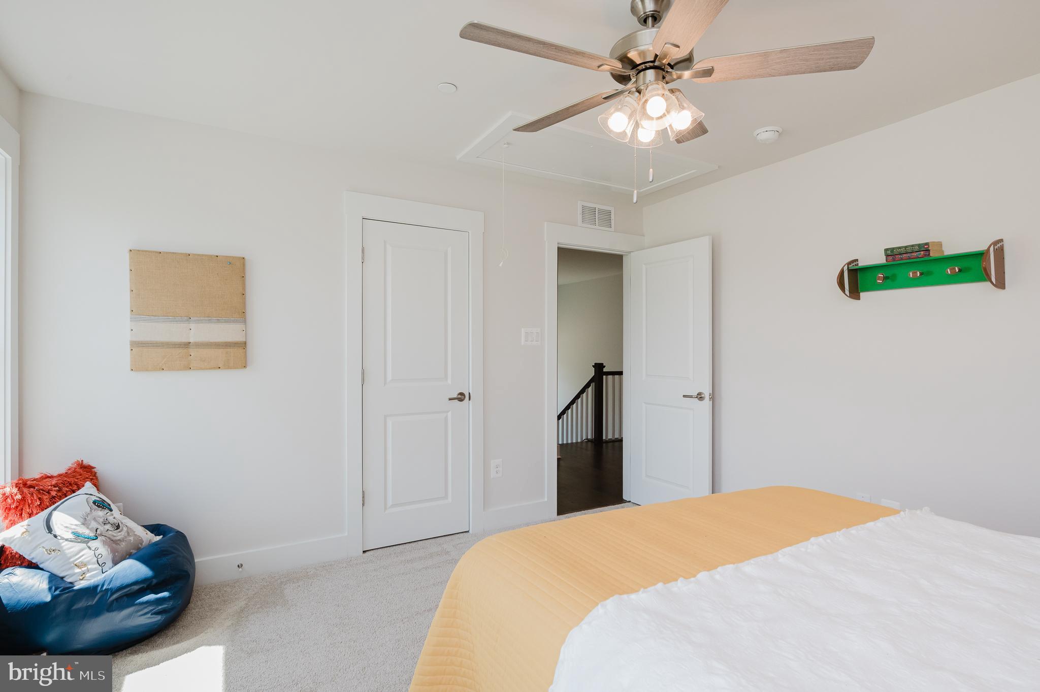 5725 Hodges Road Sykesville, MD 21784 - Photo 55 of 56 a bedroom with a bed and a ceiling fan