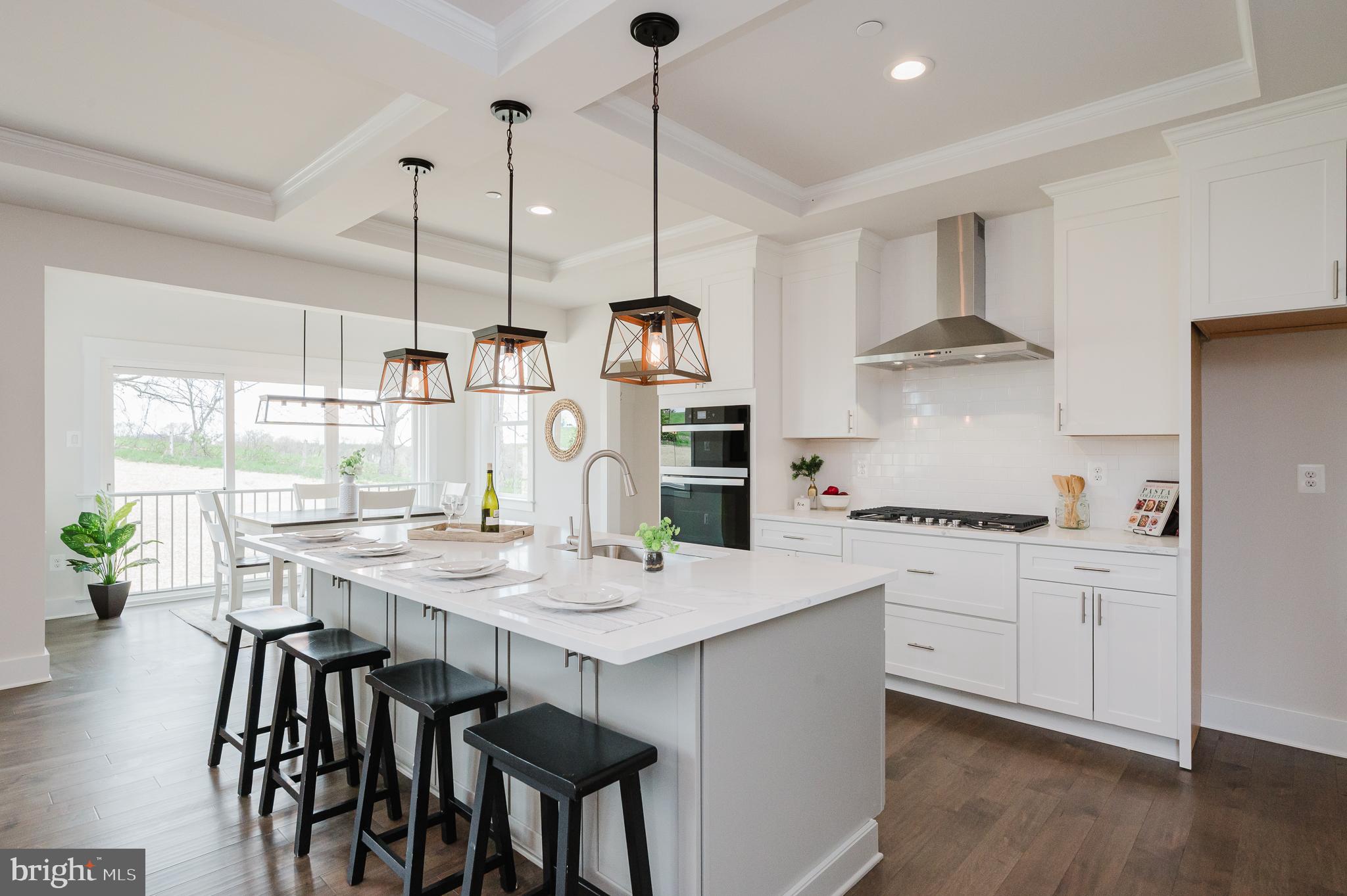 5725 Hodges Road Sykesville, MD 21784 - Photo 7 of 56 a kitchen with stainless steel appliances granite countertop a stove a sink dishwasher and a refrigerator with wooden floor