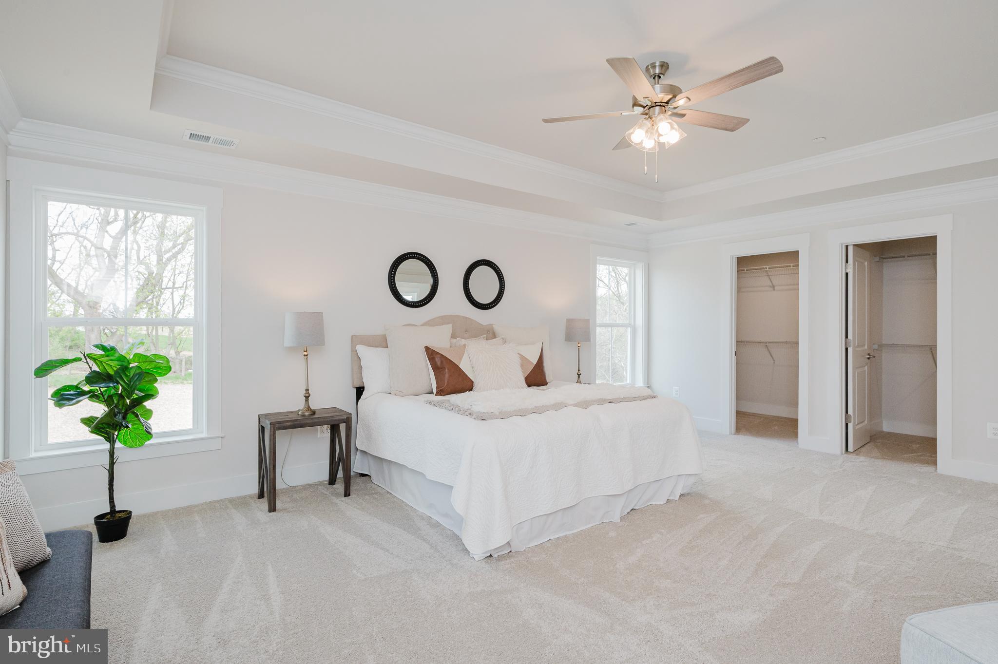 5725 Hodges Road Sykesville, MD 21784 - Photo 10 of 56 a bedroom with a bed and a chandelier