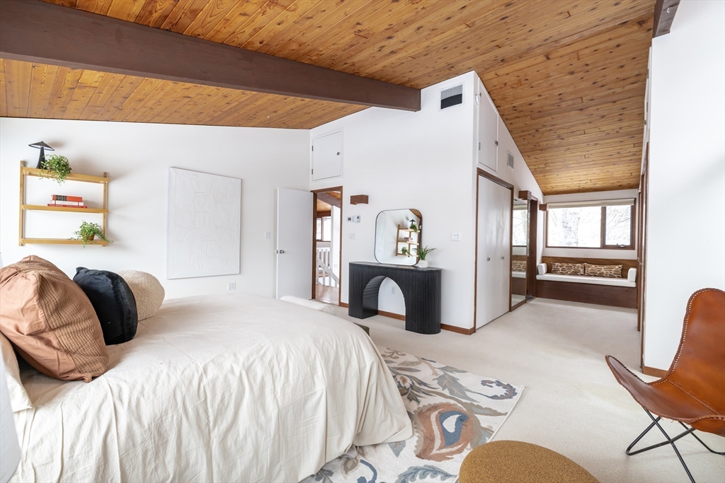 134 Rangeley Road Brookline, MA 02467 - Photo 12 of 27 a bedroom with a bed and a chair