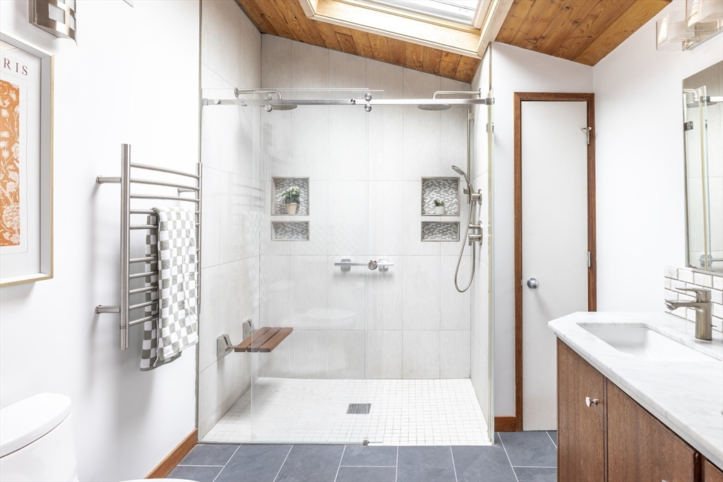 134 Rangeley Road Brookline, MA 02467 - Photo 15 of 27 a bathroom with a shower and a sink