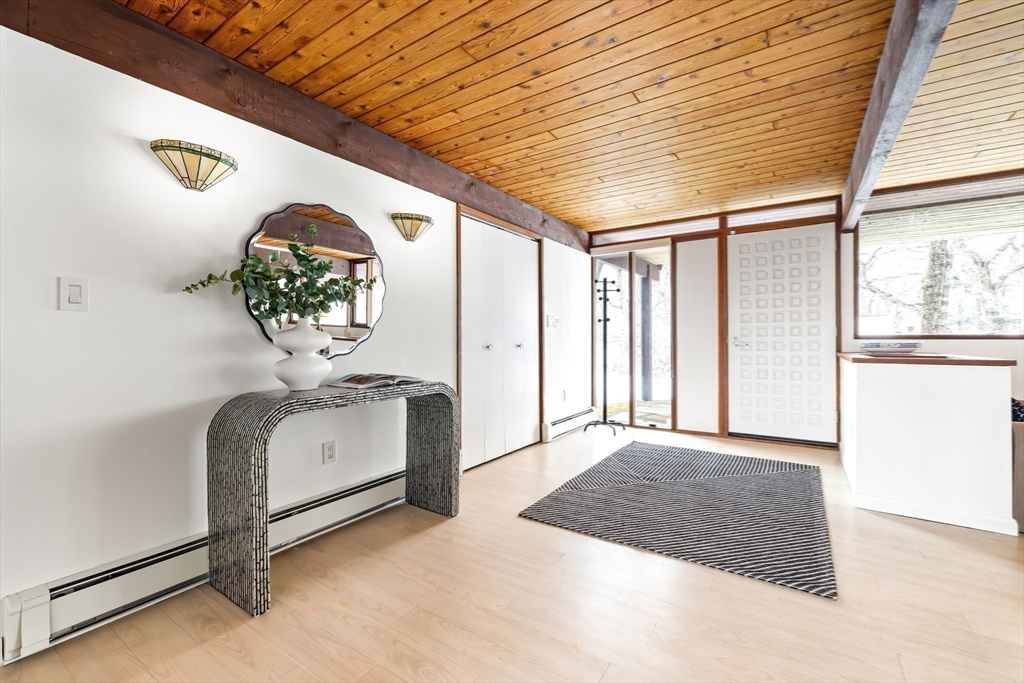 134 Rangeley Road Brookline, MA 02467 - Photo 16 of 27 a view of an entryway with a chandelier
