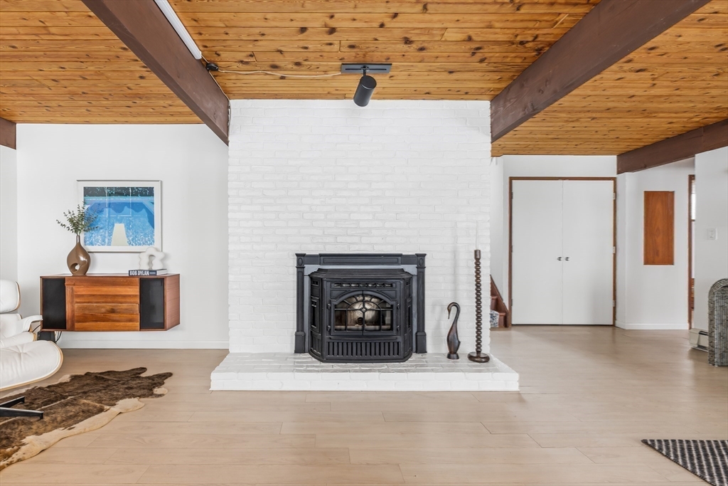 134 Rangeley Road Brookline, MA 02467 - Photo 19 of 27 a living room with furniture and a fireplace