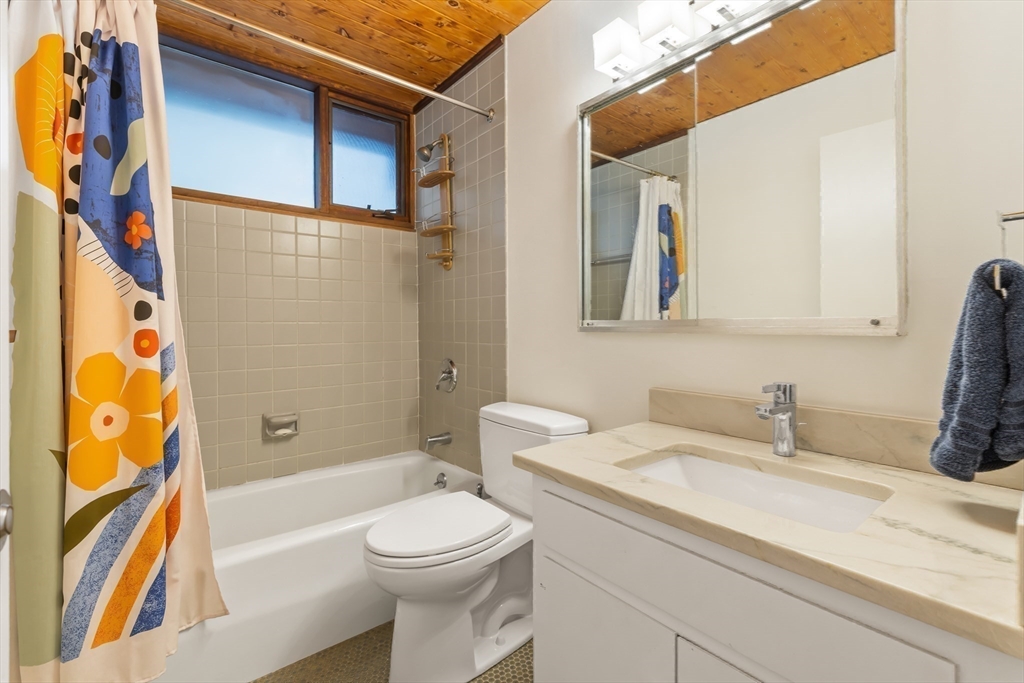 134 Rangeley Road Brookline, MA 02467 - Photo 20 of 27 a bathroom with a sink a toilet and a bathtub