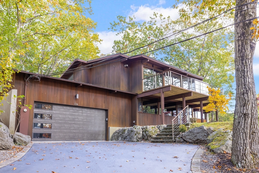 134 Rangeley Road Brookline, MA 02467 - Photo 23 of 27 a front view of a house with a garden