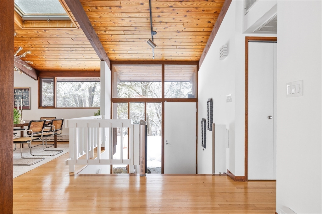 134 Rangeley Road Brookline, MA 02467 - Photo 9 of 27 an empty room with wooden floor and windows