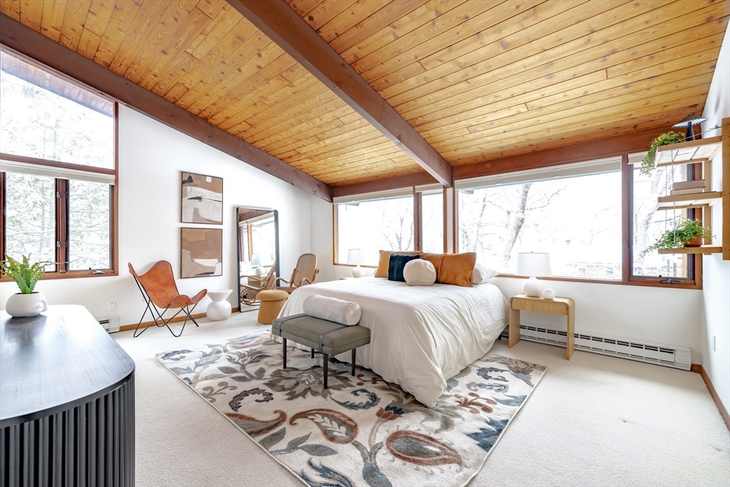 134 Rangeley Road Brookline, MA 02467 - Photo 10 of 27 a spacious bedroom with a bed and a large window