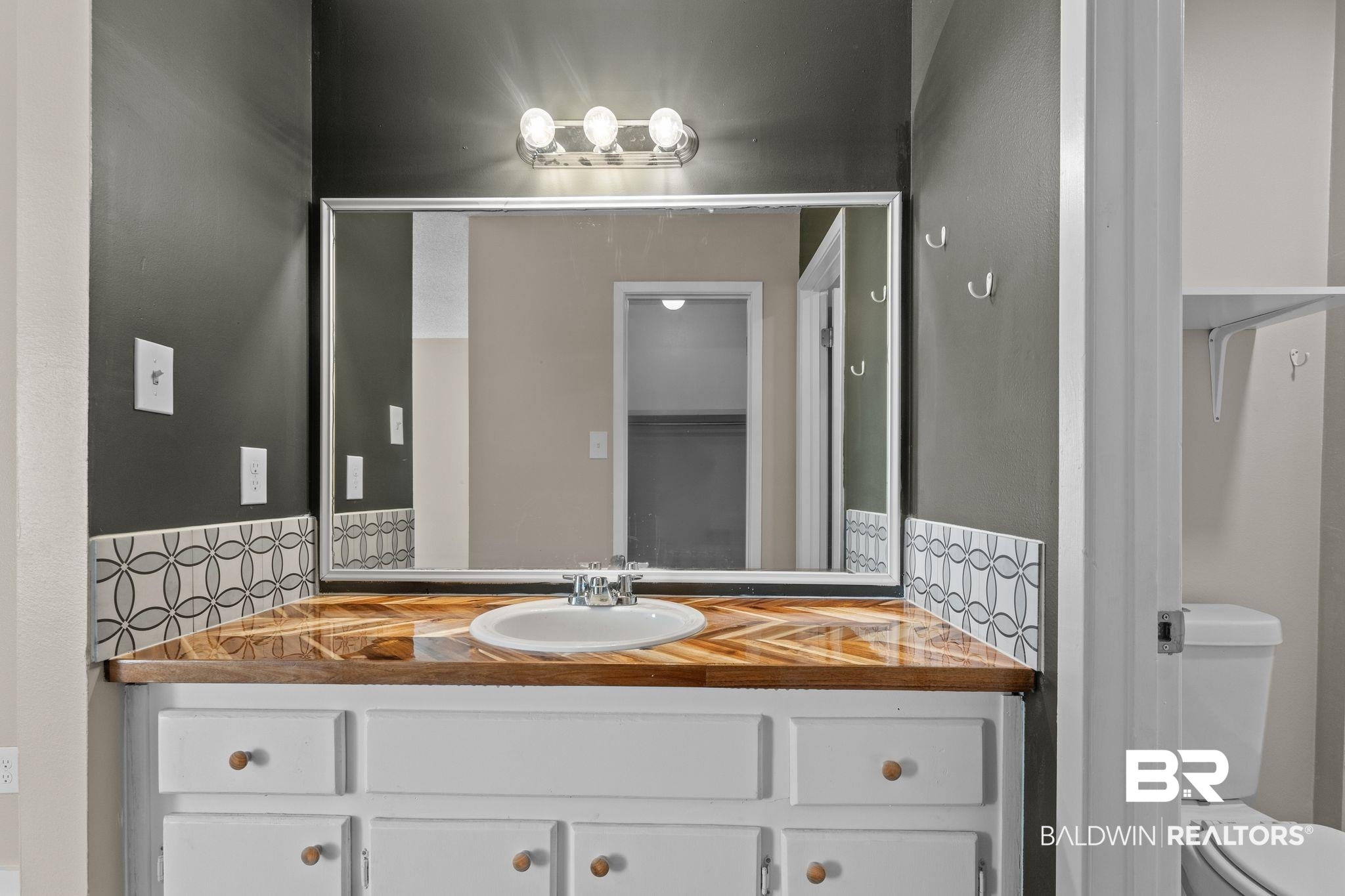 128 West Satsuma Avenue, Unit 128 Foley, AL 36535 - Photo 20 of 41 Bathroom featuring toilet and vanity