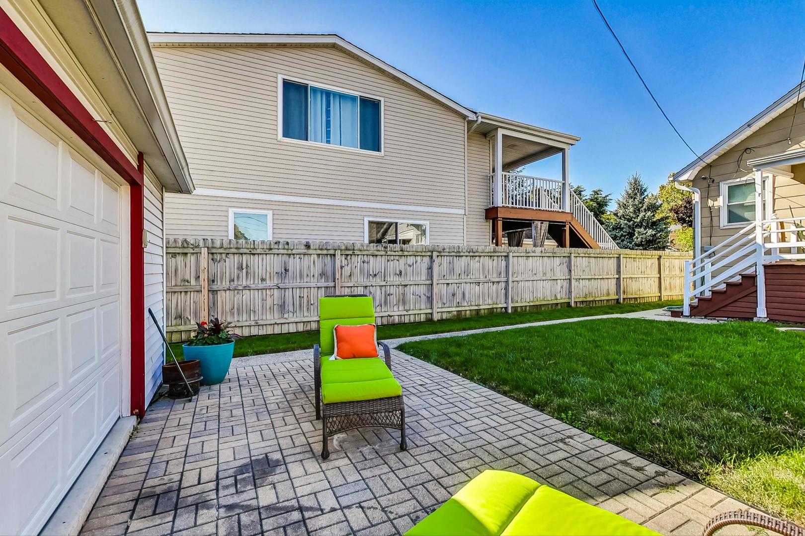 1434 Elgin Avenue Forest Park, IL 60130 - Photo 30 of 35 a view of a backyard with plants and a patio