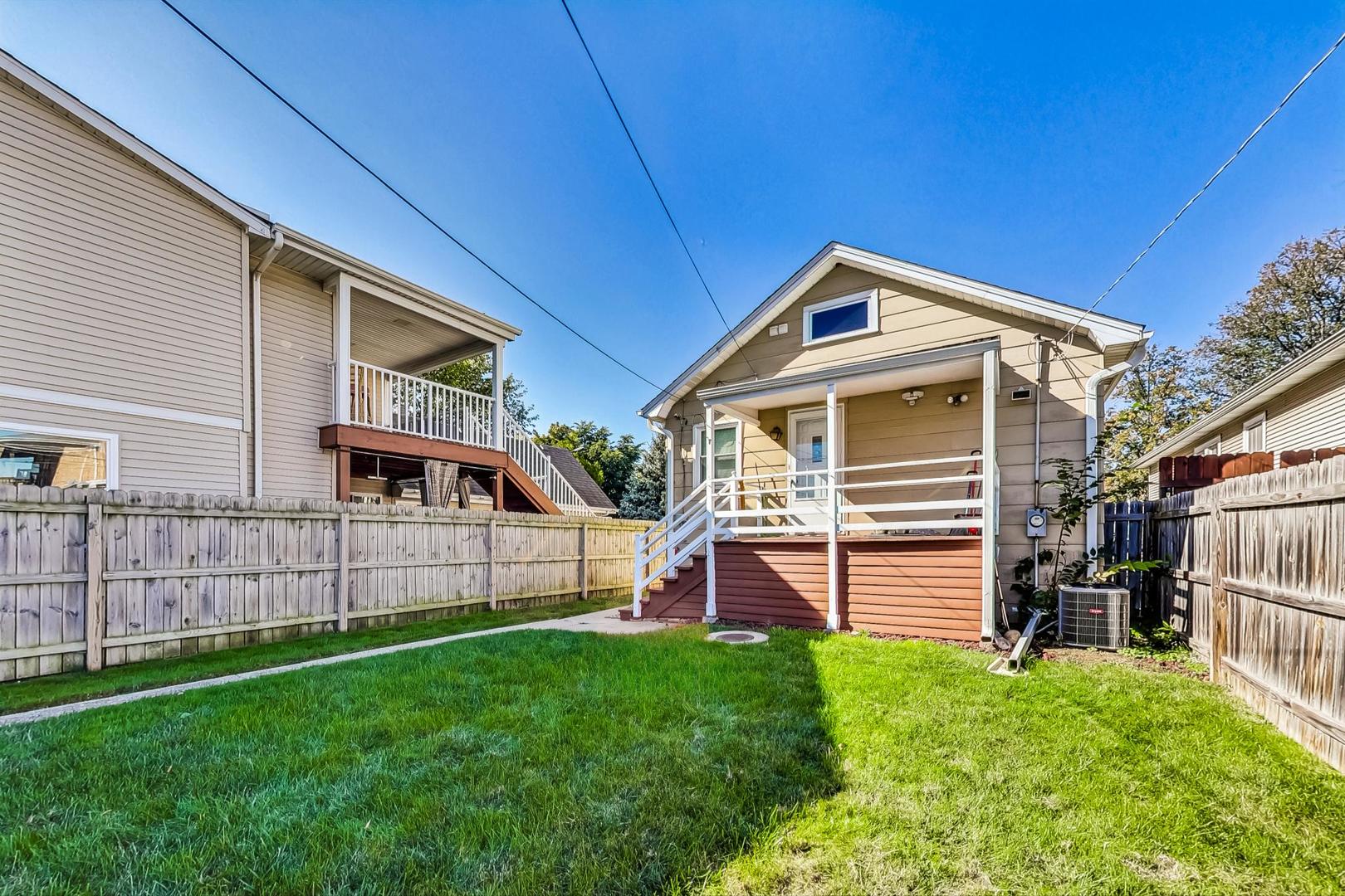 1434 Elgin Avenue Forest Park, IL 60130 - Photo 33 of 35 a front view of a house with a garden