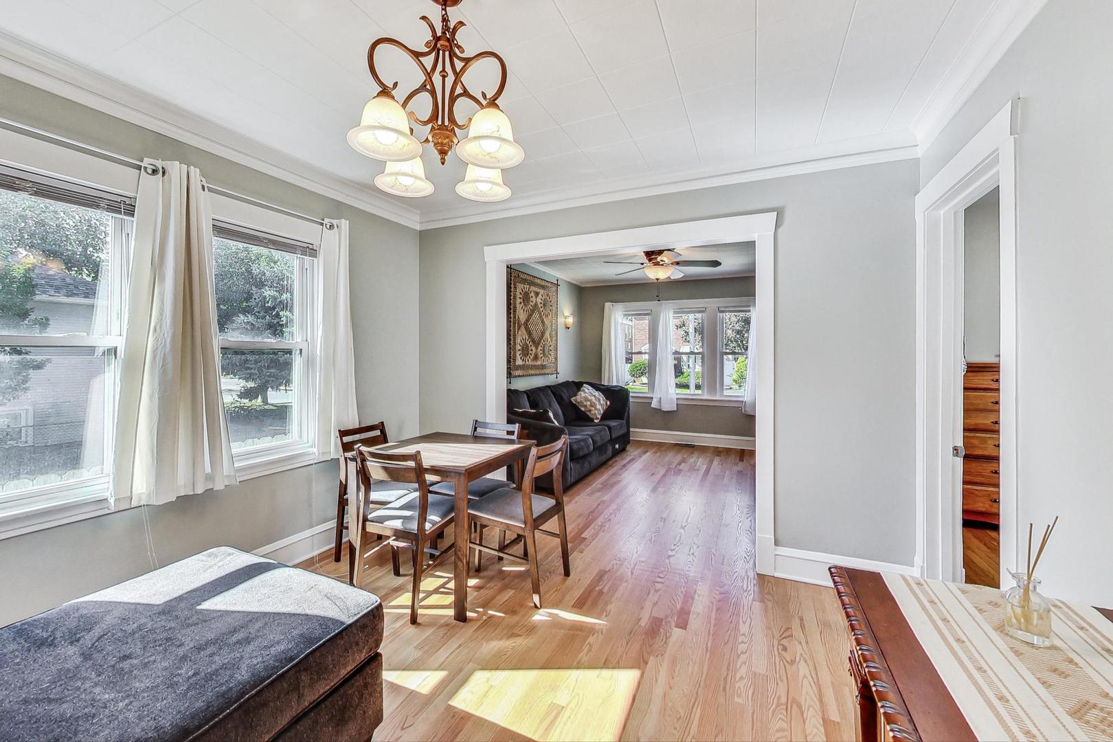 1434 Elgin Avenue Forest Park, IL 60130 - Photo 9 of 35 a view of a dining room with furniture window and wooden floor