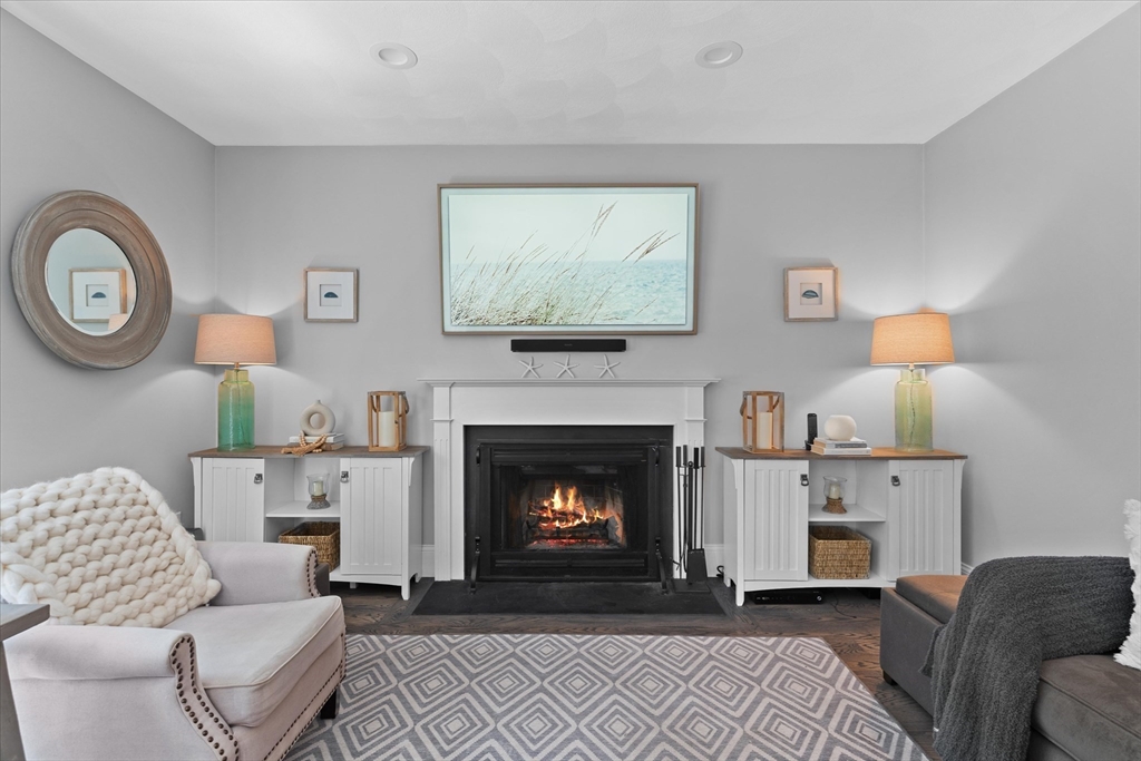 69 Curzon Mill Road Newburyport, MA 01950 - Photo 13 of 40 a living room with furniture and a fireplace