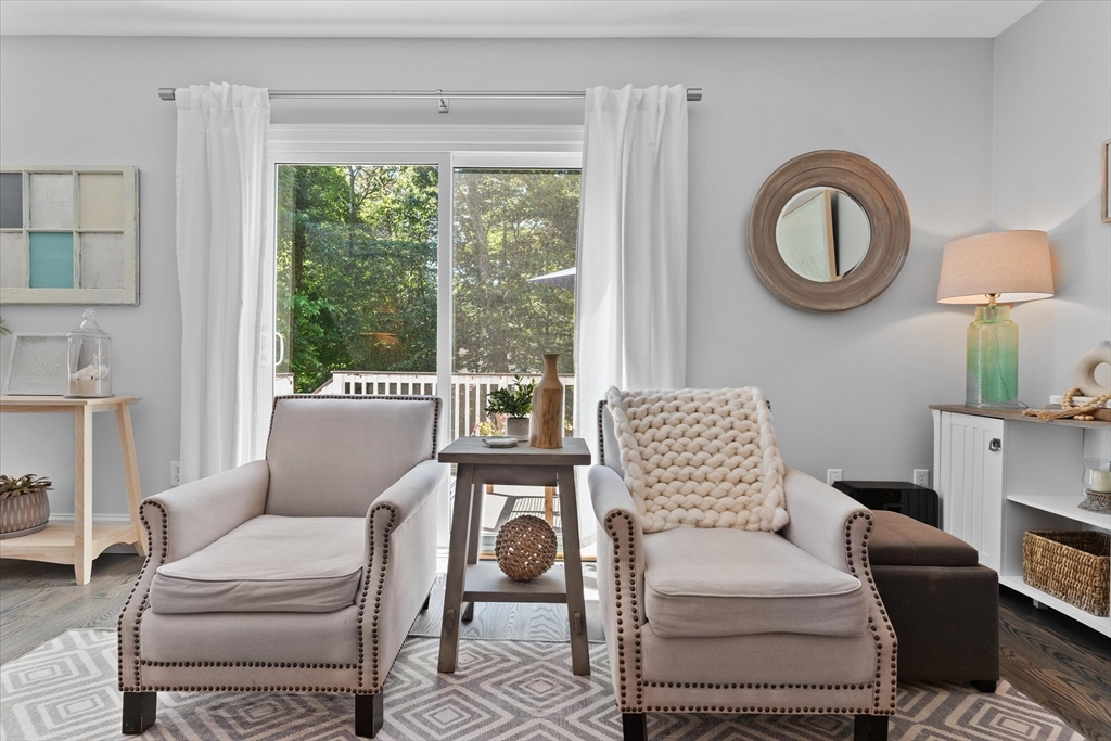 69 Curzon Mill Road Newburyport, MA 01950 - Photo 14 of 40 a living room with furniture and a large window