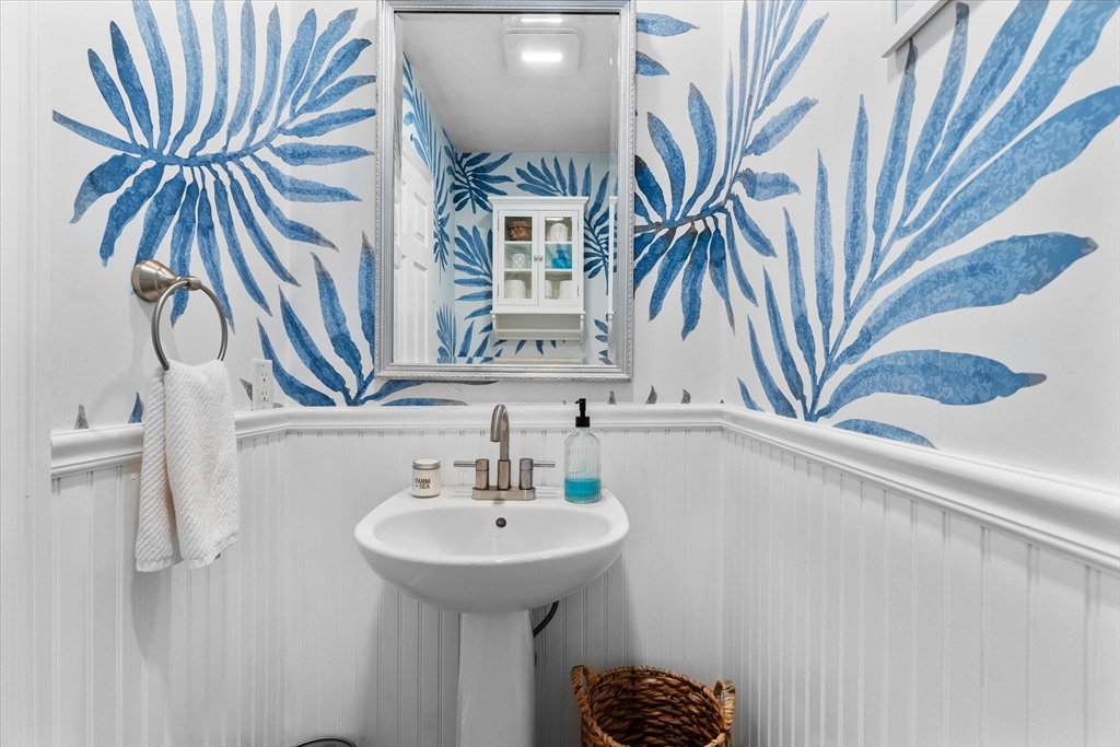 69 Curzon Mill Road Newburyport, MA 01950 - Photo 20 of 40 a bathroom with a sink and a mirror