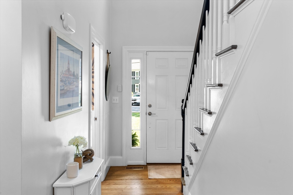 69 Curzon Mill Road Newburyport, MA 01950 - Photo 21 of 40 a view of entryway with wooden floor and stairs